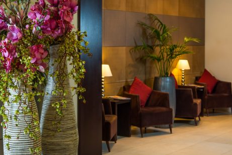Lobby of a hotel in London, featuring elegant decor and comfortable seating arrangements.
