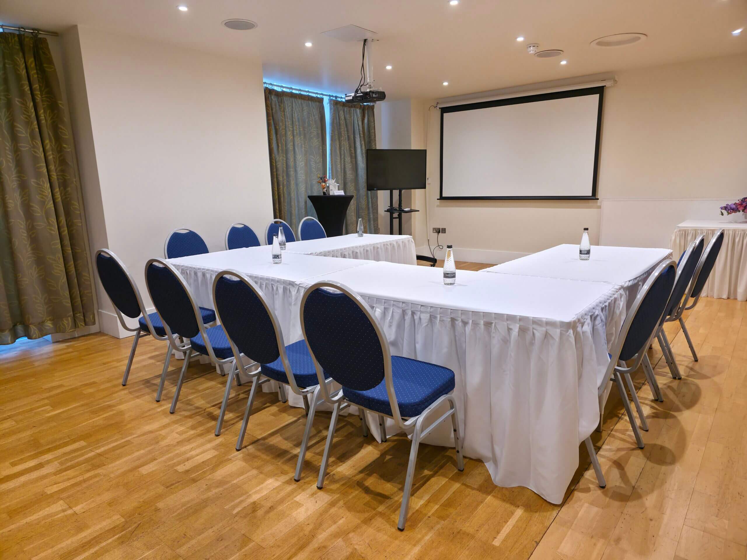 Interior view of Garden Room meeting and event space set for 80 guests